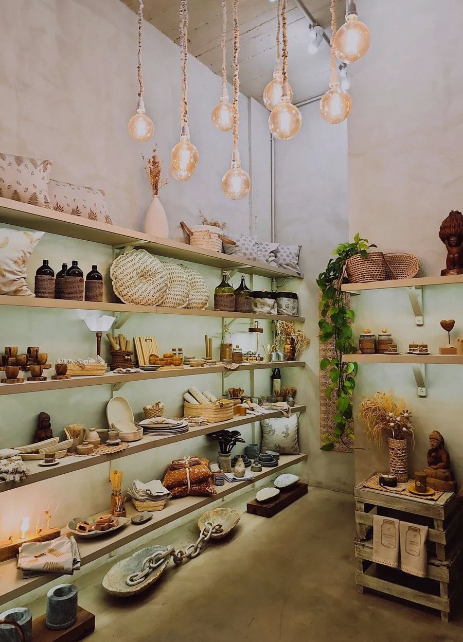 Charming shop interior showcasing decor items with ambient lighting, creating a cozy atmosphere.